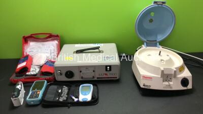 Mixed Lot Including 1 x LuxTec 9000 Xenon Light Series Light Source Unit (Powers Up) 2 x HemoCue 201+ Blood Analyzers (Both Untested Due to No Batteries) 1 x Welch Allyn Thermoscan Thermometer with Base Unit (Powers Up) 1 x PC-900B Capnograph and Oximeter