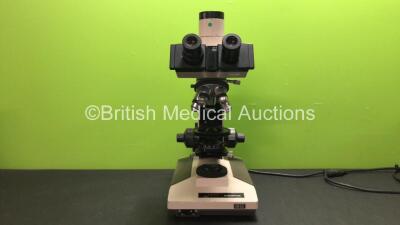 Olympus BH2 Bench Microscope Including 1 x Olympus 0.10 DPlan 4 Optic, 1 x Ceti PL 100/1.25 oil Optic, 1 x Olympus 0.25 DPlan Optic, 1 x Olympus 0.65 DPlan 40 Optic and 1 x Olympus DPlan 0.40 Optic (Powers Up)