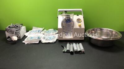 Mixed Lot Including 1 x Eschmann VP25 Suction Unit with 1 x Cup (Powers Up with Missing Lid) 8 x Flexicare F4 Bags with Taps *All Out of Date* 4 x Laryngoscope Handles. 1 x Surgical Instrument Tray and 1 x ALM Ref 542123919 Power Supply (Powers Up) *SN TE