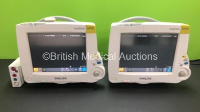 2 x Philips Intellivue MP30 Patient Monitors with 1 x Philips M3001A Module Including ECG, SpO2, Press-Temp *Mfd 2011* and NBP Options *Mfd 2006* (Both Power Up with Some Casing Damage - See Photo)