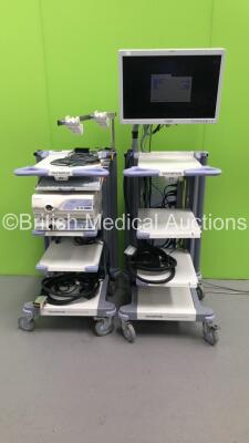 2 x Olympus Stack Trolleys with Olympus OEV261H Monitor, Olympus Evis Lucera CLV-260 Light Source, Olympus Evis Lucera CV-260 Digital Processor, Olympus ECS-260 Connector Cable and Keyboard (Powers Up) *S/N 7516781 / 7525597*