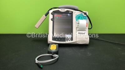 Philips MRx Defibrillator Including ECG and Printer Options with 1 x Philips M3538A Battery, 1 x Philips M3539A Module, 1 x Paddle Lead, 1 x Philips M3725A Test Load and 1 x Laerdal CPR Meter (Powers Up)