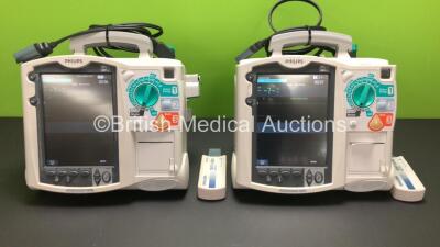 2 x Philips MRx Defibrillators Including 2 x Pacer, 2 x ECG, 2 x SpO2, 2 x BP and 2 x Printer Options with 2 x Philips M3538A Batteries, 2 x Philips M3539A Modules, 2 x Paddle Leads and 2 x Philips M3725A Test Loads (Both Power Up) **Batteries Housed With