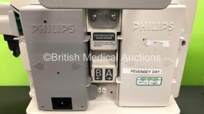 2 x Philips Heartstart MRx Defibrillators Including ECG and Printer Options with 2 x Paddle Leads and 2 x Philips M3725A Test Loads 2 x M3539A Modules and 2 x Philips M3538A Batteries *Mfd 2011 - 2008* (Both Power Up) - 3