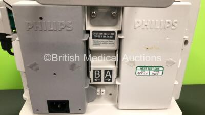 2 x Philips Heartstart MRx Defibrillators Including ECG and Printer Options with 2 x Paddle Leads and 2 x Philips M3725A Test Loads 2 x M3539A Modules and 2 x Philips M3538A Batteries *Mfd 2011 - 2008* (Both Power Up) - 4