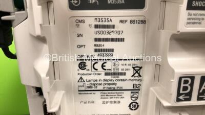 2 x Philips Heartstart MRx Defibrillators Including ECG and Printer Options with 2 x Paddle Leads and 2 x Philips M3725A Test Loads 2 x M3539A Modules and 2 x Philips M3538A Batteries *Mfd 2011 - 2008* (Both Power Up) - 5