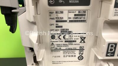 2 x Philips Heartstart MRx Defibrillators Including ECG and Printer Options with 2 x Paddle Leads and 2 x Philips M3725A Test Loads 2 x M3539A Modules and 2 x Philips M3538A Batteries *Mfd 2011 - 2008* (Both Power Up) - 6