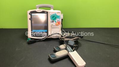 Philips MRx Defibrillator Including ECG and Printer Options with 1 x Philips M3538A Battery, 1 x Philips M3539A Module, 1 x Paddle Lead, 1 x Philips M3725A Test Load and 2 x Laerdal CPR Meters (Powers Up)