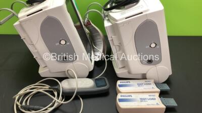 2 x Philips Heartstart MRx Defibrillators Including ECG and Printer Options with 2 x Paddle Leads and 2 x Philips M3725A Test Loads, 1 x QCPR Meter, 2 x M3539A Modules and 2 x Philips M3538A Batteries *Mfd 2011 - 2011* (Both Power Up) - 2