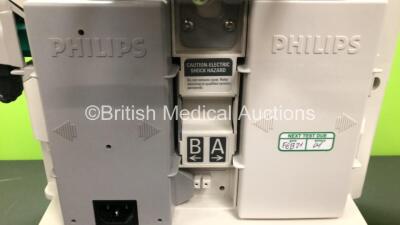 2 x Philips Heartstart MRx Defibrillators Including ECG and Printer Options with 2 x Paddle Leads and 2 x Philips M3725A Test Loads, 1 x QCPR Meter, 2 x M3539A Modules and 2 x Philips M3538A Batteries *Mfd 2011 - 2011* (Both Power Up) - 3