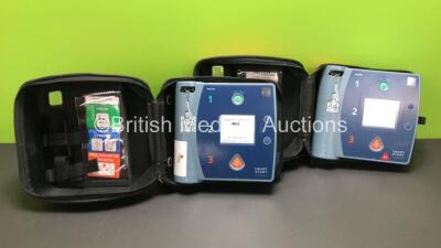 2 x Philips Heartstart FR2+ Defibrillators with 2 x Philips M3863A Batteries *Install Dates 04-2023, 09-2022* and Carry Cases (Both Power Up and Pass Self Test)