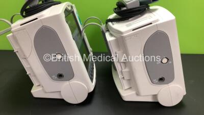 2 x Philips Heartstart MRx Defibrillators Including ECG and Printer Options with 2 x Paddle Leads and 2 x Philips M3725A Test Loads 2 x M3539A Modules and 2 x Philips M3538A Batteries *Mfd 2011 - 2011* (Both Power Up) - 2