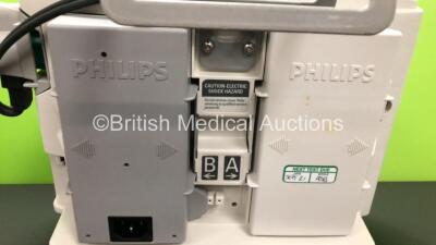 2 x Philips Heartstart MRx Defibrillators Including ECG and Printer Options with 2 x Paddle Leads and 2 x Philips M3725A Test Loads 2 x M3539A Modules and 2 x Philips M3538A Batteries *Mfd 2011 - 2011* (Both Power Up) - 3