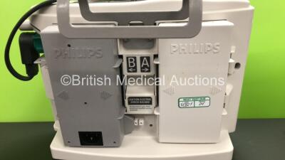 2 x Philips Heartstart MRx Defibrillators Including ECG and Printer Options with 2 x Paddle Leads and 2 x Philips M3725A Test Loads 2 x M3539A Modules and 2 x Philips M3538A Batteries *Mfd 2011 - 2011* (Both Power Up) - 4