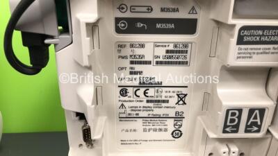 2 x Philips Heartstart MRx Defibrillators Including ECG and Printer Options with 2 x Paddle Leads and 2 x Philips M3725A Test Loads 2 x M3539A Modules and 2 x Philips M3538A Batteries *Mfd 2011 - 2011* (Both Power Up) - 6