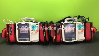 2 x Philips MRx Defibrillators Including Pacer, ECG and Printer Options with 2 x Philips M3538A Batteries, 2 x Philips M3539A Modules, 2 x Paddle Leads, 2 x Philips M3725A Test Loads and 2 x Carry Bags (Both Power Up) *SN US00329919 - US00533142*