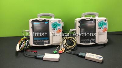 2 x Philips MRx Defibrillators Including Pacer, ECG and Printer Options with 2 x Philips M3538A Batteries, 2 x Philips M3539A Modules, 2 x Paddle Leads, 2 x 3 Lead ECG Leads and 2 x Philips M3725A Test Loads (Both Power Up) *SN US00329917 - US00329920*