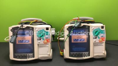 2 x Philips MRx Defibrillators Including Pacer, ECG and Printer Options with 2 x Philips M3538A Batteries, 2 x Philips M3539A Modules, 2 x Paddle Leads and 2 x 3 Lead ECG Leads (Both Power Up) *SN US00329924 - US00329922*