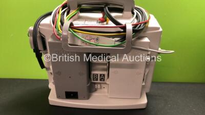 2 x Philips MRx Defibrillators Including Pacer, ECG and Printer Options with 2 x Philips M3538A Batteries, 2 x Philips M3539A Modules, 2 x Paddle Leads and 2 x 3 Lead ECG Leads (Both Power Up) *SN US00329924 - US00329922* - 5