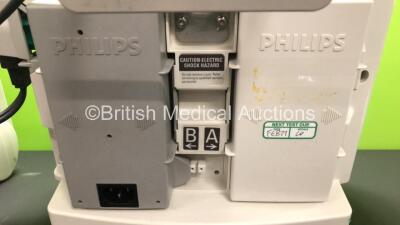 2 x Philips Heartstart MRx Defibrillators Including ECG and Printer Options with 2 x Paddle Leads and 2 x Philips M3725A Test Loads 2 x M3539A Modules and 2 x Philips M3538A Batteries *Mfd 2008 - 2008* (Both Power Up) - 3