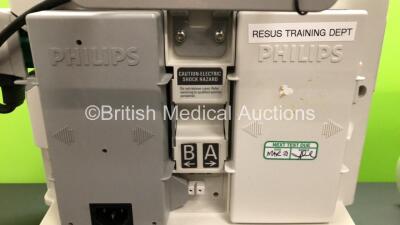 2 x Philips Heartstart MRx Defibrillators Including ECG and Printer Options with 2 x Paddle Leads and 2 x Philips M3725A Test Loads 2 x M3539A Modules and 2 x Philips M3538A Batteries *Mfd 2008 - 2008* (Both Power Up) - 4