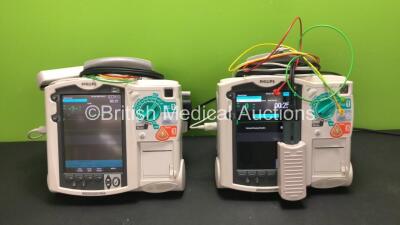 2 x Philips MRx Defibrillators Including Pacer, ECG and Printer Options with 2 x Philips M3538A Batteries, 2 x Philips M3539A Modules, 2 x Paddle Leads, 2 x 3 Lead ECG Leads and 2 x Philips M3725A Test Loads (Both Power Up) *SN US00534790 - US0059133*