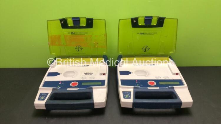 2 x Cardiac Science Powerheart AED G3 Defibrillators with 2 x Batteries (Both Power Up)