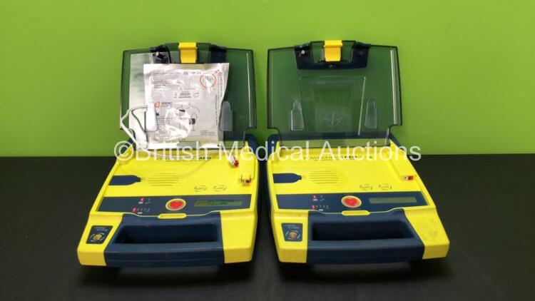 2 x Cardiac Science Powerheart AED G3 Defibrillators with 2 x Batteries (Both Power Up)