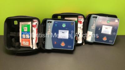 2 x Philips Heartstart FR2+ Defibrillators in Carry Cases with 2 x Batteries *Install Dates 12-2023 / 12-2019* (Both Power Up and Pass Self Test) *0510800675 - 0911891312*