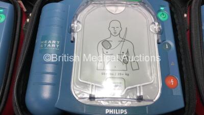 3 x Philips Heartstart HS1 Defibrillators with 3 x Carry Cases and 3 x Batteries (All Power Up) *A09F 03140 - A09F 03138 - A09F 03124* - 3