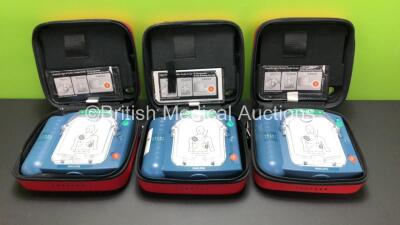 3 x Philips Heartstart HS1 Defibrillators with 3 x Carry Cases and 3 x Batteries (All Power Up) *A09F 03141 - A11D 05898 - A09J 04458*