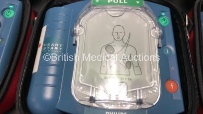 3 x Philips Heartstart HS1 Defibrillators with 3 x Carry Cases and 3 x Batteries (All Power Up) *A09F 03141 - A11D 05898 - A09J 04458* - 3