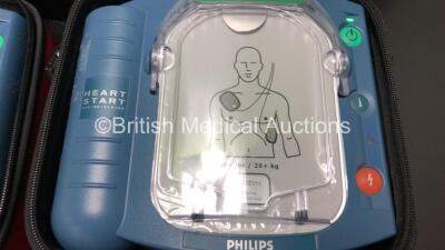 3 x Philips Heartstart HS1 Defibrillators with 3 x Carry Cases and 3 x Batteries (All Power Up) *A09F 03141 - A11D 05898 - A09J 04458* - 4