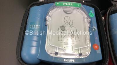 3 x Philips Heartstart HS1 Defibrillators with 3 x Carry Cases and 3 x Batteries (All Power Up) *A09F 03148 - A09F 03056 - A09L 00143* - 2