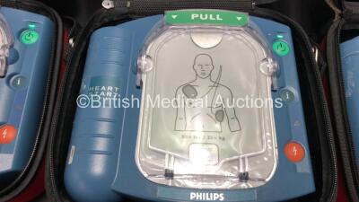 3 x Philips Heartstart HS1 Defibrillators with 3 x Carry Cases and 3 x Batteries (All Power Up) *A09F 03148 - A09F 03056 - A09L 00143* - 3