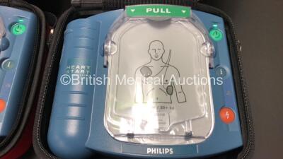 3 x Philips Heartstart HS1 Defibrillators with 3 x Carry Cases and 3 x Batteries (All Power Up) *A09F 03148 - A09F 03056 - A09L 00143* - 4