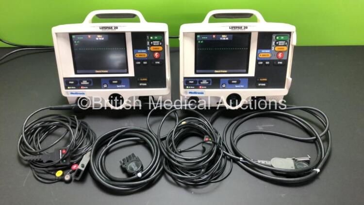 2 x Medtronic Lifepak 20 Defibrillators / Monitor Including ECG and Printer Options with 2 x Paddle Leads and 2 x ECG Leads *Mfd 2006 - 2005* (Both Power Up)