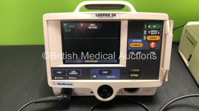 2 x Medtronic Lifepak 20 Defibrillator / Monitors with ECG and Printer Options, 2 x Paddle Leads and 2 x 3 Lead ECG Leads (Both Power Up 1 with Missing Door-See Photo) - 2