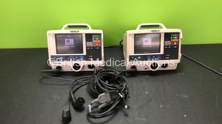 2 x Medtronic Lifepak 20 Defibrillator / Monitors with ECG and Printer Options, 2 x Paddle Leads and 2 x 3 Lead ECG Leads (Both Power Up with Missing Panel Doors-See Photos)