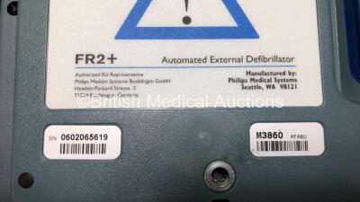 Job Lot Including 1 x Philips HeartStart FR2+ Defibrillator (Powers Up and Passes Self Test with Stock Battery - Some Damage to Display - See Photo) 1 x Laerdal HeartStart FR2+ Defibrillator (Powers Up Failing Self Test) 1 x Philips M3863A Battery (Flat) - 8