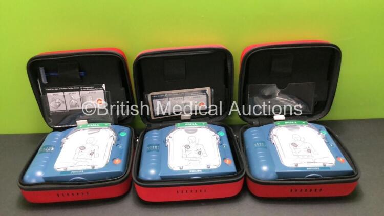 3 x Philips Heartstart HS1 Defibrillators in Carry Cases with 3 x Batteries (All Power Up) *SN A12C01103 - A10A00301 - A09F03126*