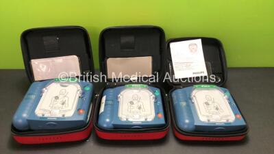 3 x Philips Heartstart HS1 Defibrillators in Carry Cases with 3 x Batteries (All Power Up) *SN A09F03062 - A09F03134 - A15F05431*