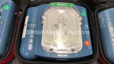 3 x Philips Heartstart HS1 Defibrillators in Carry Cases with 3 x Batteries (All Power Up) *SN A09F03062 - A09F03134 - A15F05431* - 2