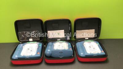 3 x Philips Heartstart HS1 Defibrillators in Carry Cases with 3 x Batteries (All Power Up) *SN A09F03136 - A09F03136 - A09F03132*