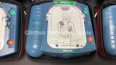 3 x Philips Heartstart HS1 Defibrillators in Carry Cases with 3 x Batteries (All Power Up) *SN A09F03136 - A09F03136 - A09F03132* - 2