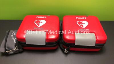 2 x Philips HeartStart FR3 Defibrillators in Cases with 2 x Batteries * Install Before 2022 - 2024 * (Both Power Up) * SN C18G 002257 - C17A 00173* - 9