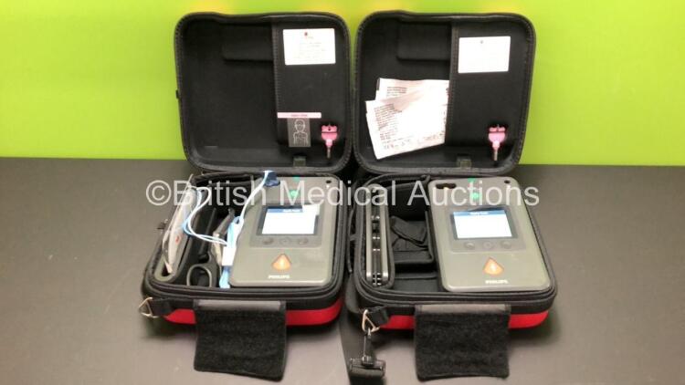 2 x Philips HeartStart FR3 Defibrillators in Cases with 2 x Batteries * Install Before 2024 - 2024 * (Both Power Up) * SN C18G 01359 - C18G 00066*