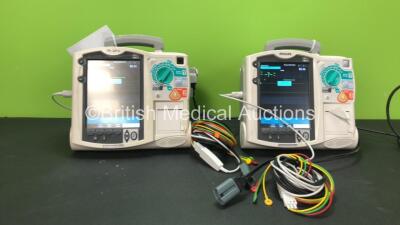 2 x Philips MRx Defibrillators Including Pacer, ECG and Printer Options with 2 x Philips M3538A Batteries, 2 x Philips M3539A Modules, 2 x Paddle Leads and 2 x 3 Lead ECG Leads (Both Power Up) *SN US0032223768 - US00322235 - 307713 - 307720*