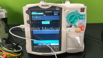 2 x Philips MRx Defibrillators Including Pacer, ECG and Printer Options with 2 x Philips M3538A Batteries, 2 x Philips M3539A Modules, 2 x Paddle Leads and 2 x 3 Lead ECG Leads (Both Power Up) *SN US0032223768 - US00322235 - 307713 - 307720* - 3