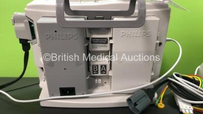 2 x Philips MRx Defibrillators Including Pacer, ECG and Printer Options with 2 x Philips M3538A Batteries, 2 x Philips M3539A Modules, 2 x Paddle Leads and 2 x 3 Lead ECG Leads (Both Power Up) *SN US0032223768 - US00322235 - 307713 - 307720* - 5